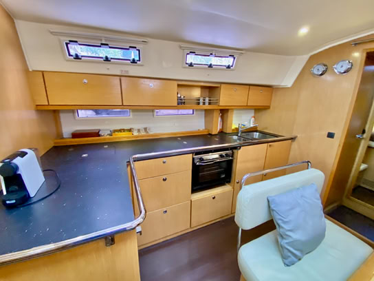 Kitchen showing Coffee Machine, Oven, Sinks and preparation area